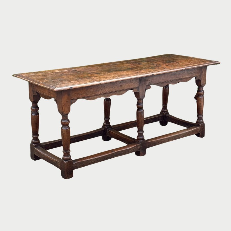 Oak refectory table c1700 of good colour and surface with 6 turned legs and box starches. 